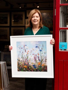 Karen holding WIshful Thinking in 60x60 limimted edition print