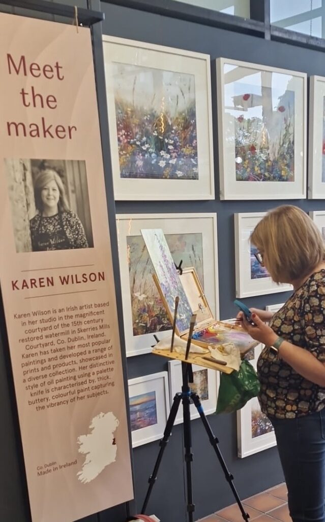 Irish Artist Karen Wilson painting in the Kilkenny Shop Nassau Street Dublin for Meet The Maker 2024